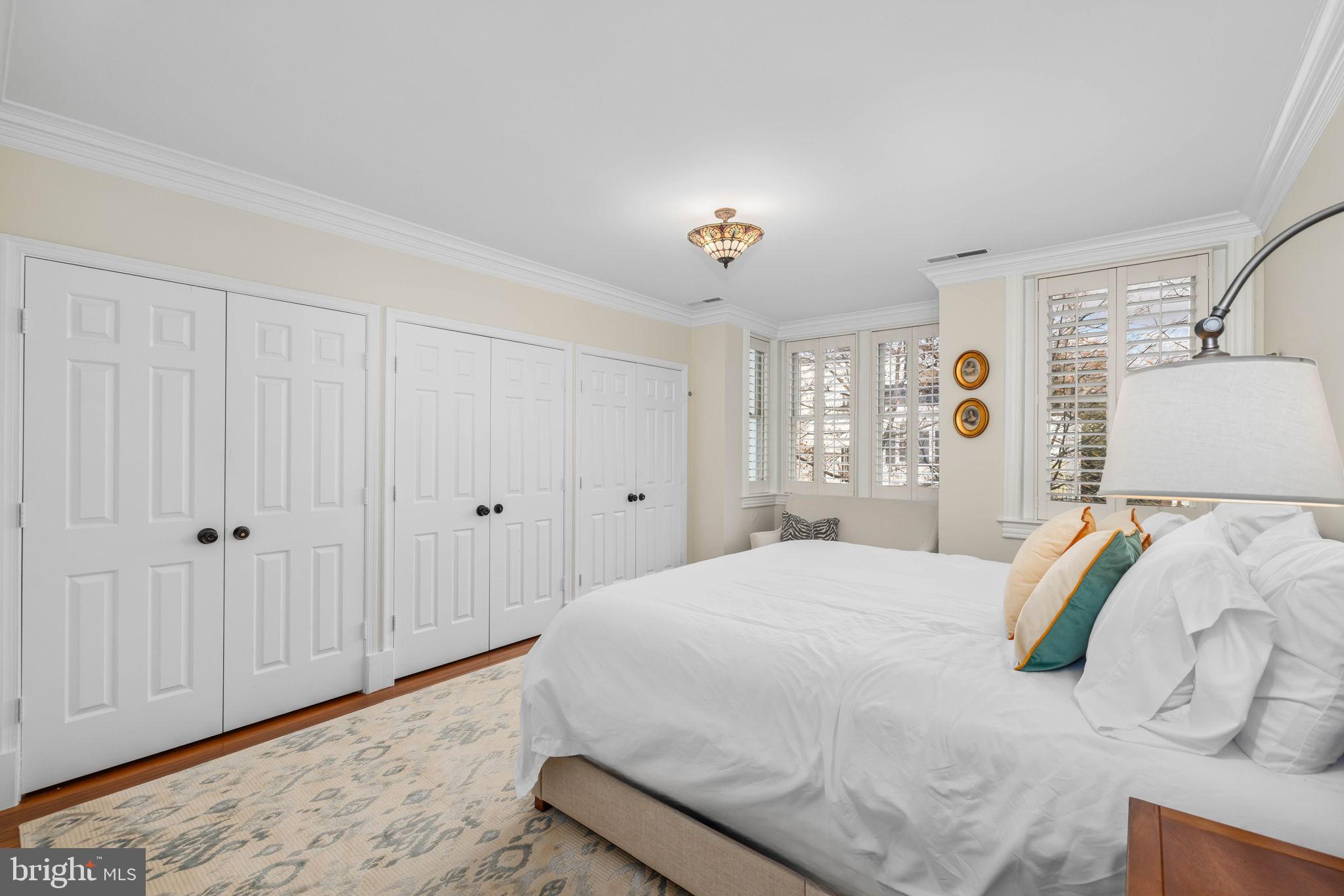 3408 Dent Place Northwest Washington, DC 20007 - Photo 10 of 17 a bedroom with a bed and a window