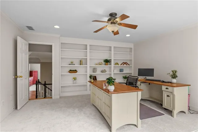 a view of pool with lawn chairs under an umbrella