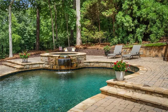 a view of a swimming pool with a patio