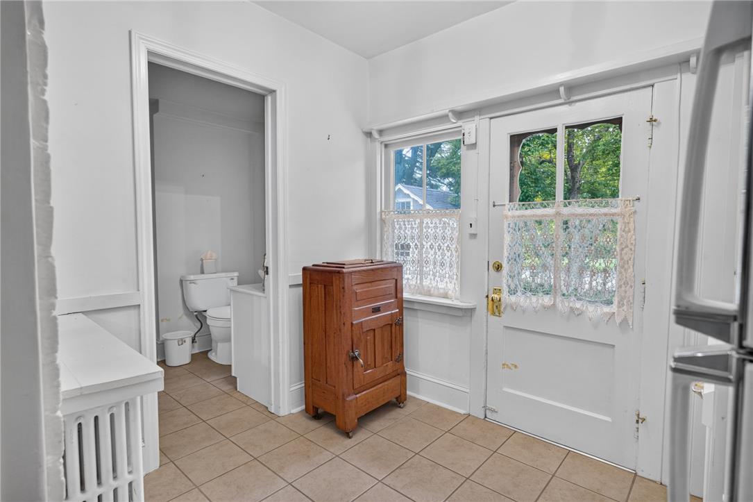 765 East Macada Road Bethlehem, PA 18017 - Photo 41 of 46 Functional entryway leading to a compact bathroom, featuring durable tile flooring and natural light.