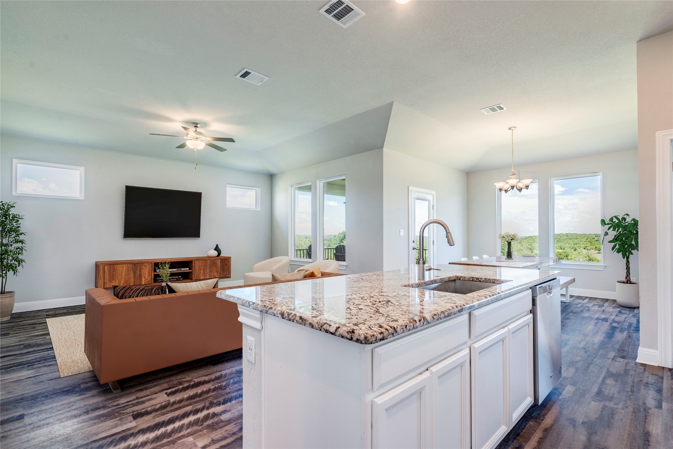 130 Sierra Blanca Road Dripping Springs, TX 78620 - Photo 2 of 24 a living room with furniture and a flat screen tv