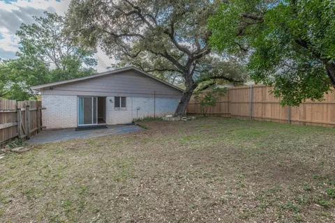 a house with a tree in front of the house