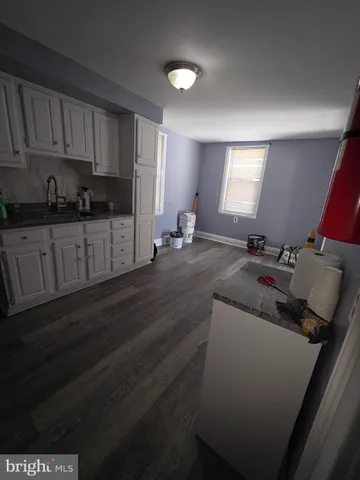 a kitchen with a sink and cabinets