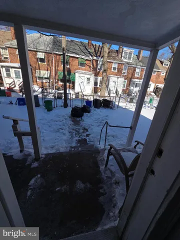 a living room with patio furniture