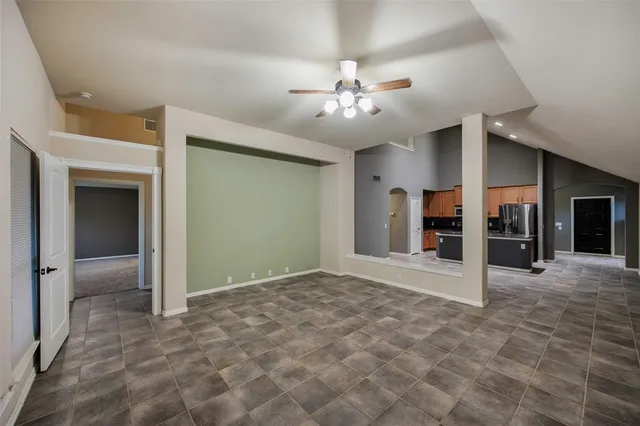 a view of an empty room with a fireplace