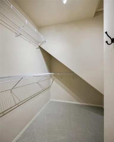 a view of an empty walk in closet