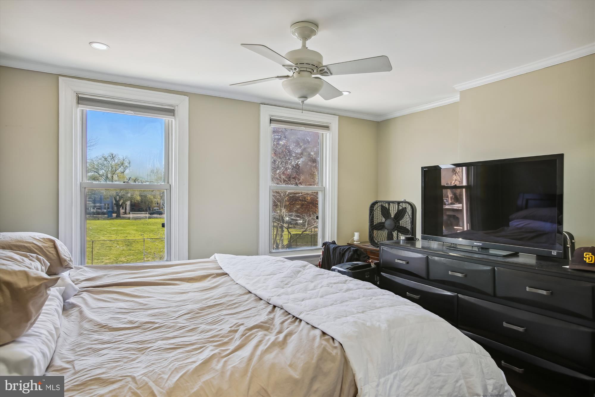 763 10th Street Southeast Washington, DC 20003 - Photo 12 of 20 a bedroom with a bed and a flat screen tv