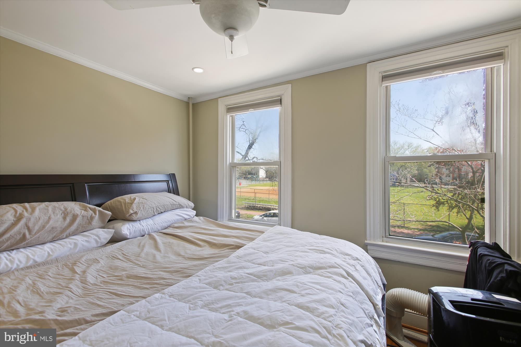 763 10th Street Southeast Washington, DC 20003 - Photo 13 of 20 a bedroom with a bed and glass window