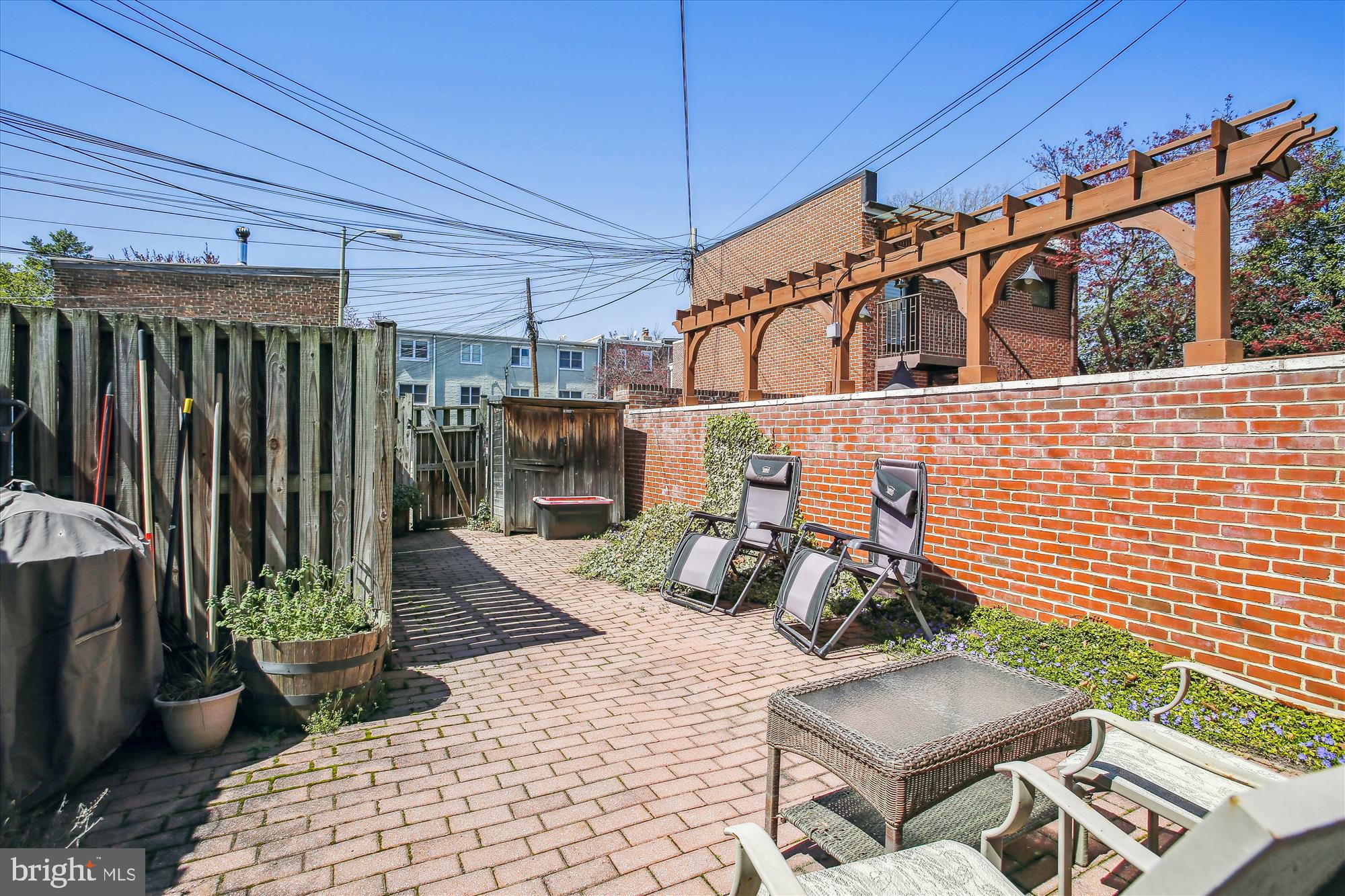 763 10th Street Southeast Washington, DC 20003 - Photo 19 of 20 a view of a patio with table and chairs with wooden floor and plants
