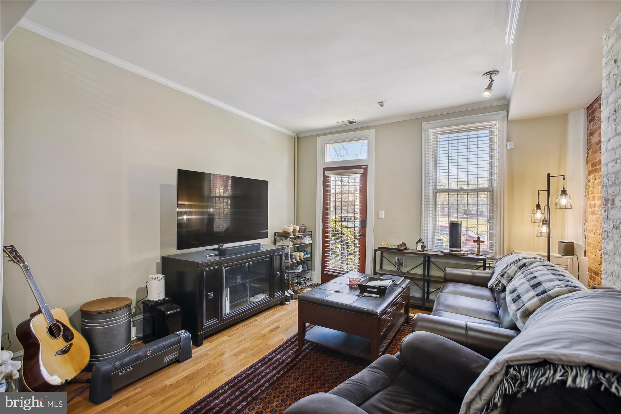 763 10th Street Southeast Washington, DC 20003 - Photo 3 of 20 a living room with furniture and a flat screen tv
