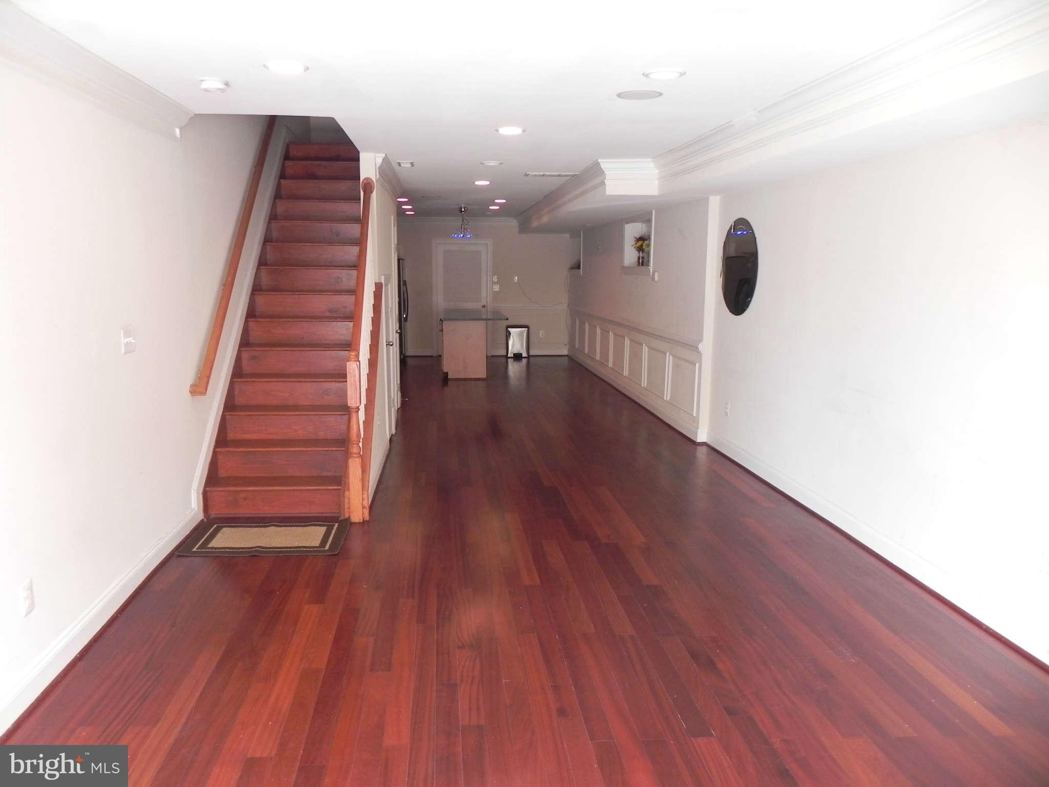 106 West Cross Street Baltimore, MD 21230 - Photo 3 of 29 a view of a hallway with wooden floor