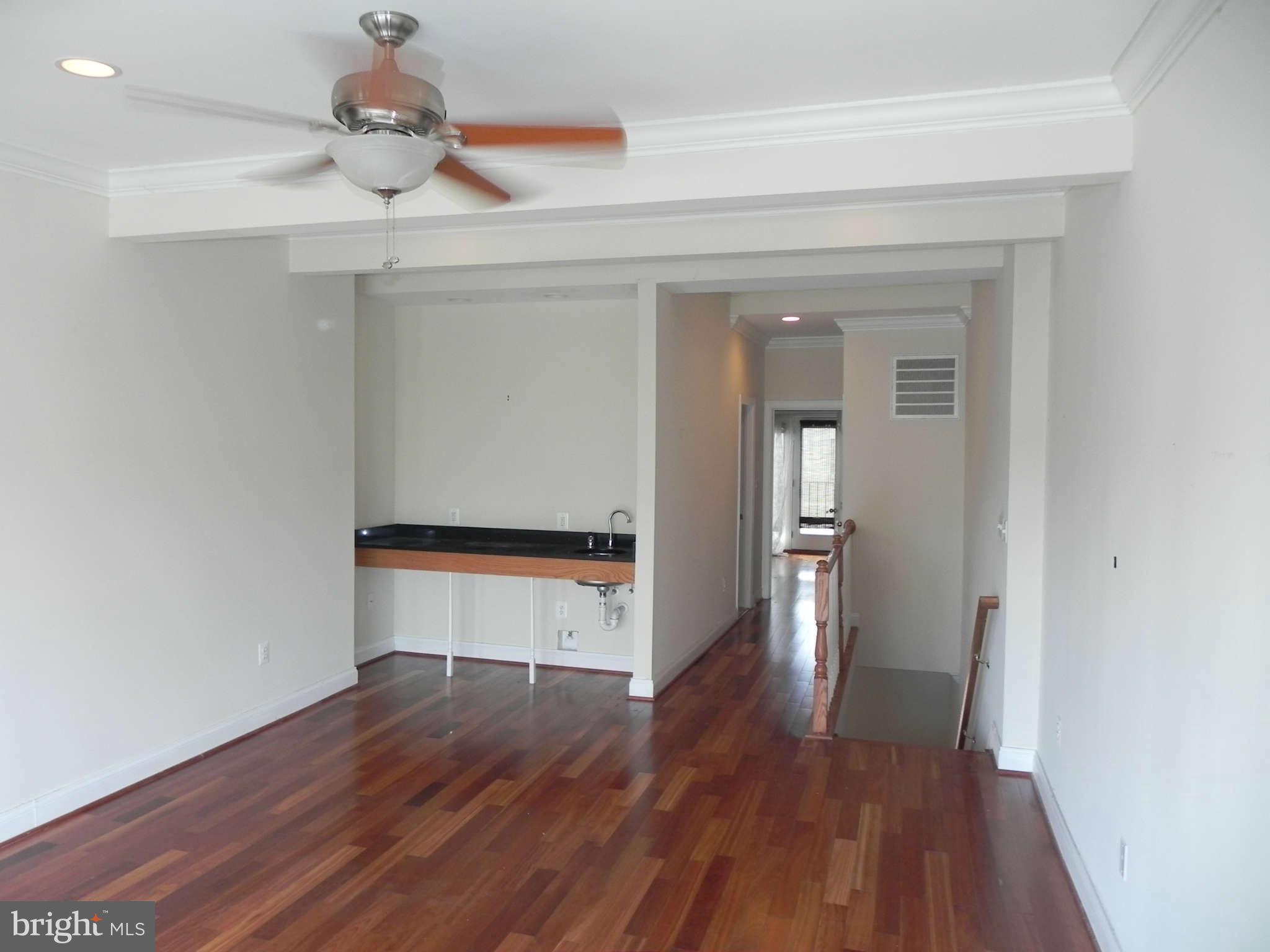 106 West Cross Street Baltimore, MD 21230 - Photo 29 of 29 a view of empty room with wooden floor