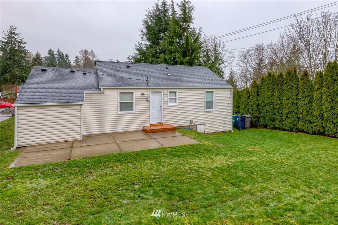 582 Bronson Way Northeast Renton, WA 98056 - Photo 14 of 16 a view of a house with a backyard
