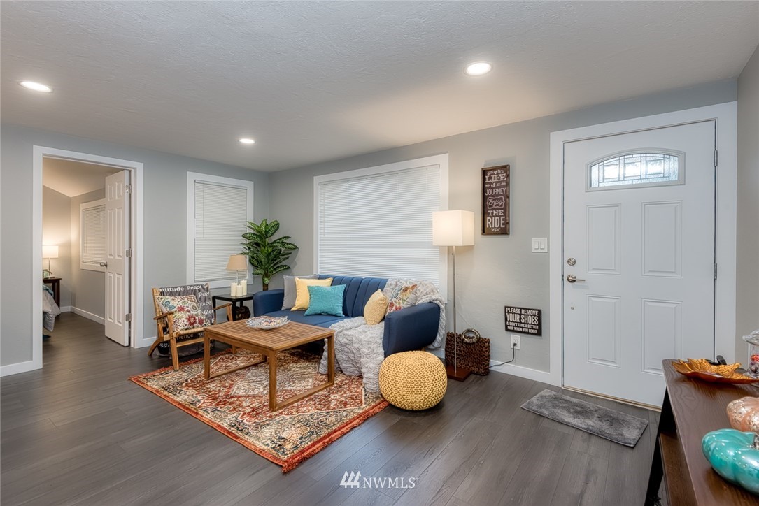 582 Bronson Way Northeast Renton, WA 98056 - Photo 3 of 16 a living room with furniture and wooden floor