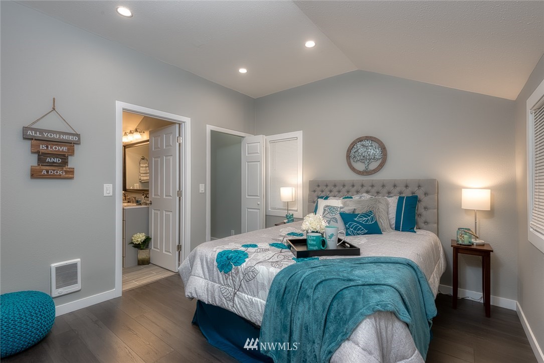 582 Bronson Way Northeast Renton, WA 98056 - Photo 8 of 16 a bedroom with a bed and a window
