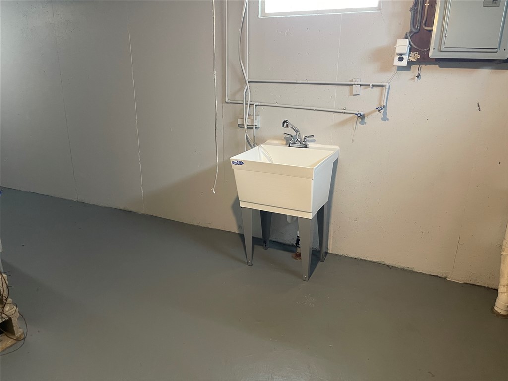 1361 Sussex Road Troy, OH 45373 - Photo 20 of 25 This functional utility room offers convenience with its robust washbasin and practical flooring.