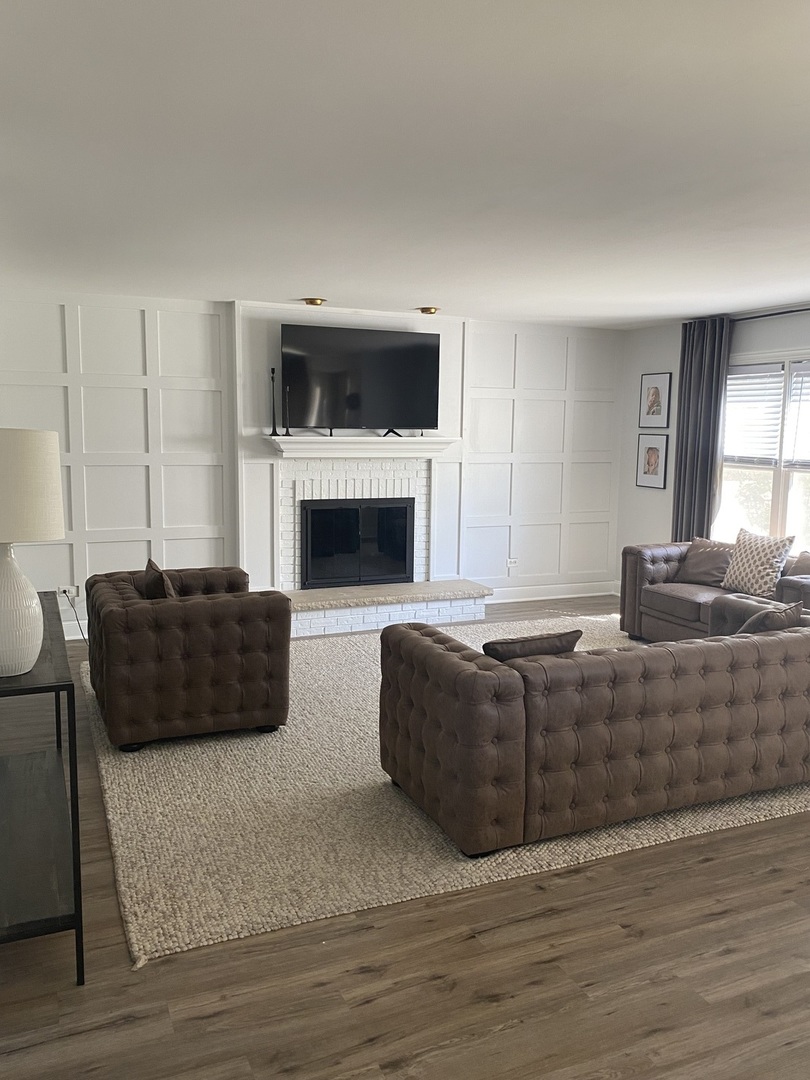 1900 Eagle Circle New Lenox, IL 60451 - Photo 6 of 16 a living room with furniture flat screen tv and a fireplace