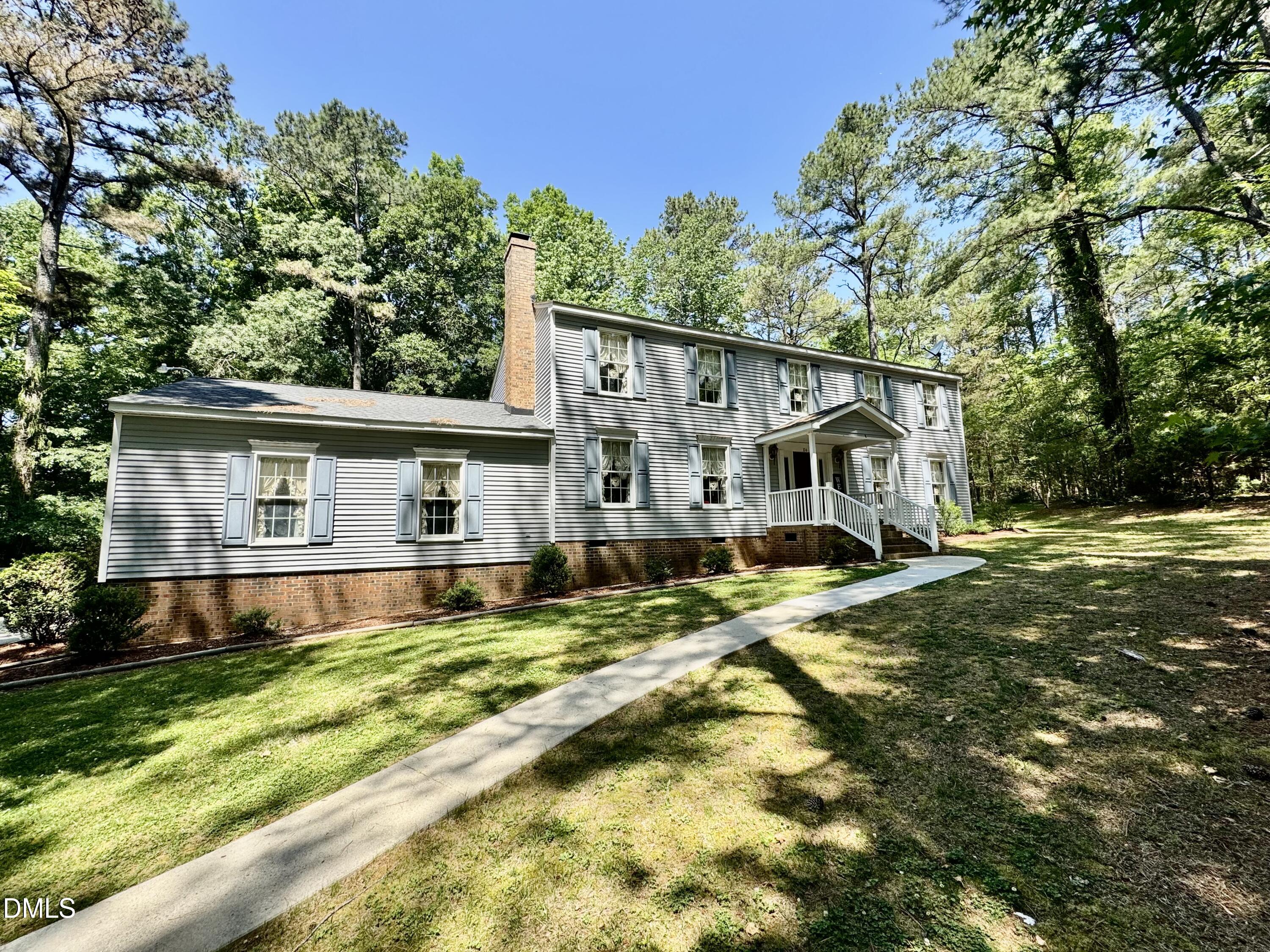 84 Wintergreen Road Henderson, NC 27537 - Photo 39 of 49 a view of a house with backyard and sitting area