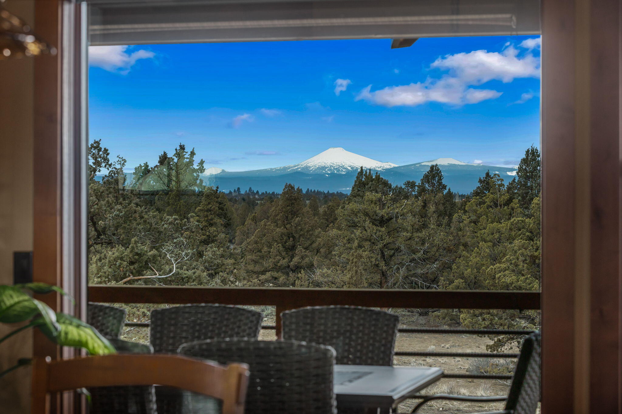 23150 Rickard Road Bend, OR 97702 - Photo 16 of 60 a view of a lake from a balcony
