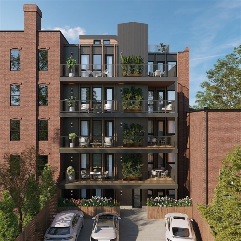 144 Worcester Street, Unit 2 Boston, MA 02118 - Photo 1 of 33 a front view of a house with lots of green space