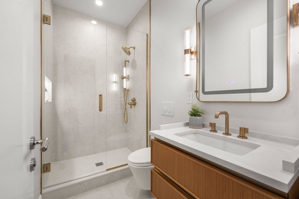 144 Worcester Street, Unit 2 Boston, MA 02118 - Photo 14 of 33 a bathroom with a sink a toilet and shower