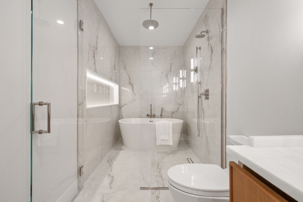 144 Worcester Street, Unit 2 Boston, MA 02118 - Photo 20 of 33 a bathroom with a toilet a sink and a shower