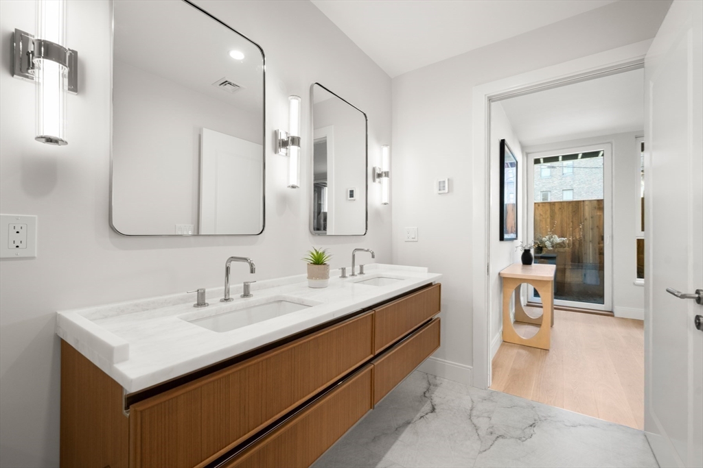 144 Worcester Street, Unit 2 Boston, MA 02118 - Photo 21 of 33 a en suite bathroom with a sink and a mirror