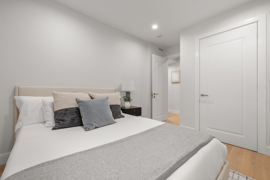 144 Worcester Street, Unit 2 Boston, MA 02118 - Photo 23 of 33 a bedroom with a bed and a night stand