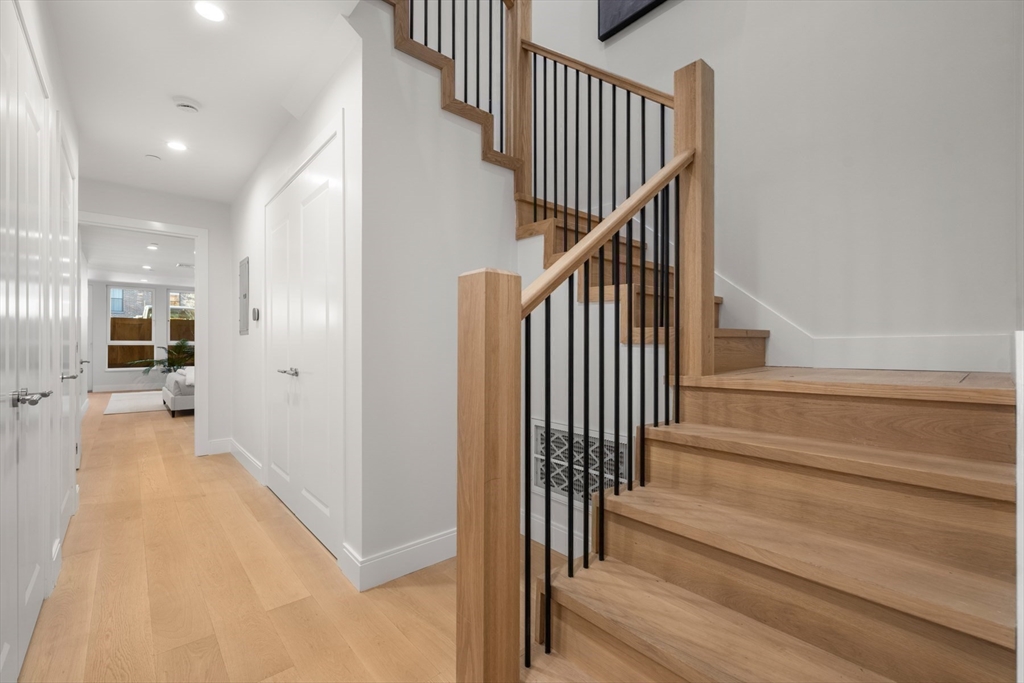 144 Worcester Street, Unit 2 Boston, MA 02118 - Photo 25 of 33 a view of a hallway with wooden floor and entryway