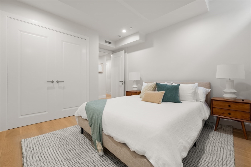 144 Worcester Street, Unit 2 Boston, MA 02118 - Photo 27 of 33 a bedroom with a bed and a night stand