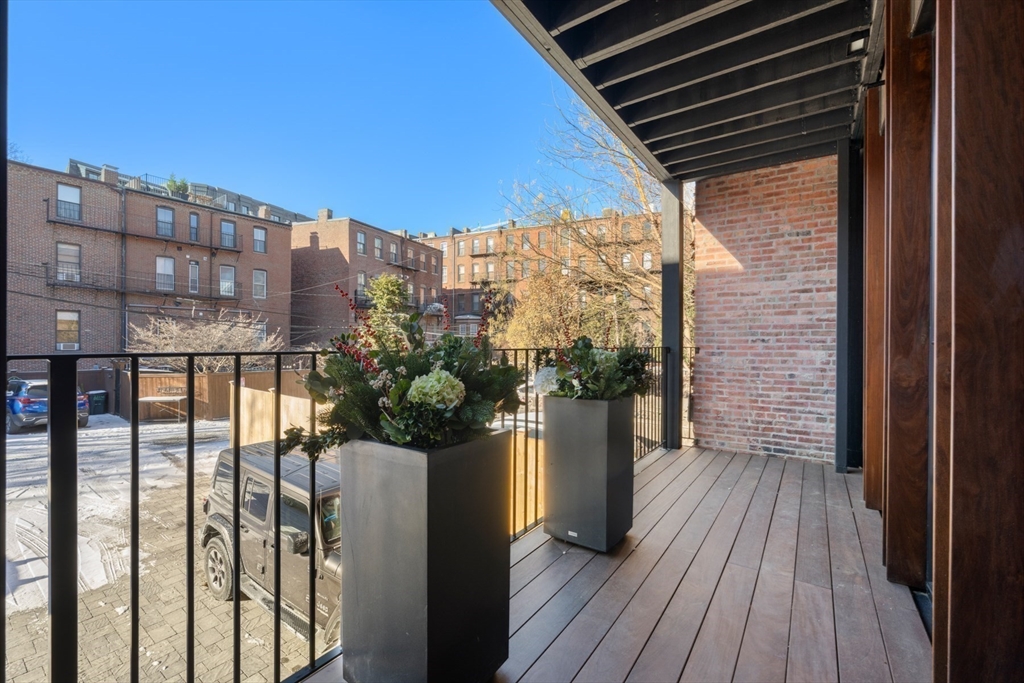 144 Worcester Street, Unit 2 Boston, MA 02118 - Photo 29 of 33 a view of a balcony with wooden floor