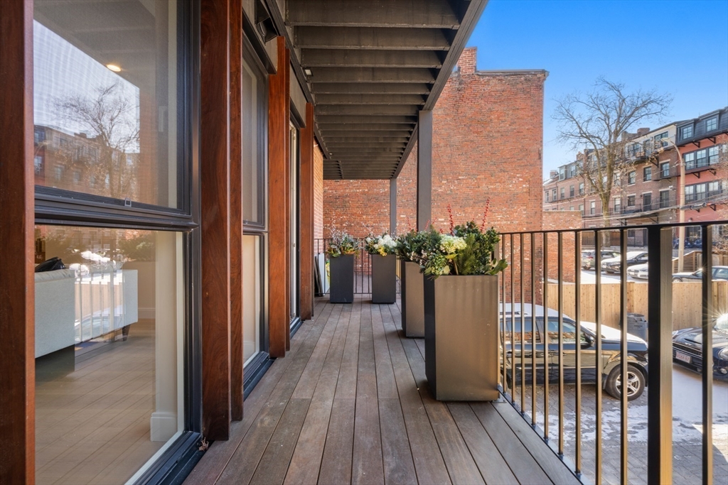 144 Worcester Street, Unit 2 Boston, MA 02118 - Photo 30 of 33 a view of a balcony with wooden floor