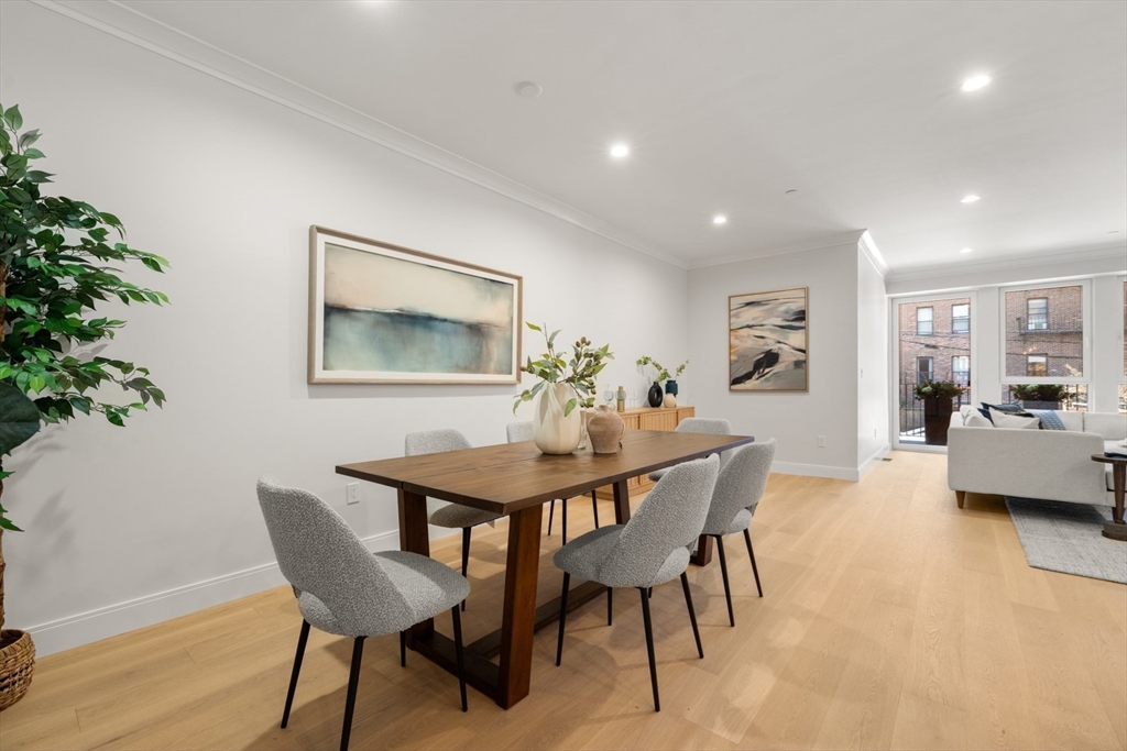 144 Worcester Street, Unit 2 Boston, MA 02118 - Photo 5 of 33 a view of a dining room with furniture and a potted plant