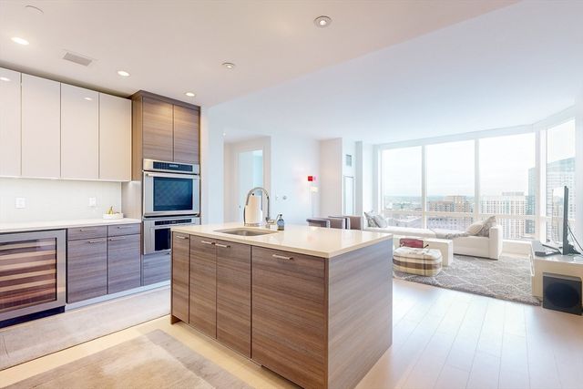 a kitchen with a sink stove and refrigerator