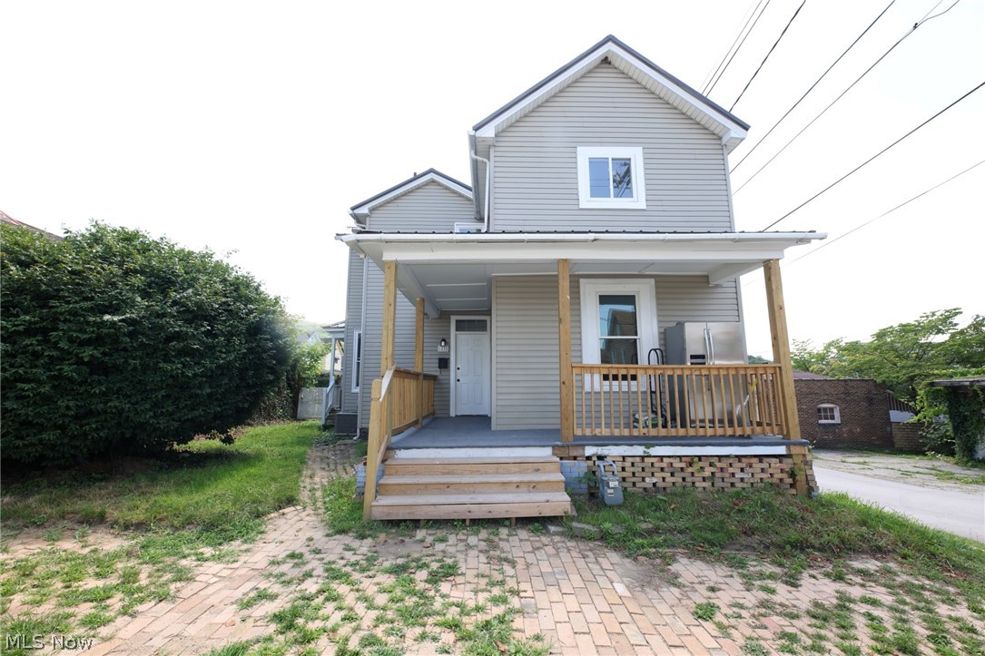 416 5th Street Chester, WV 26034 - Photo 1 of 24 Two-story facade featuring light grey siding and a white trim