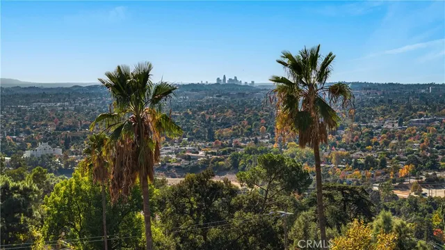 a view of a street with lots of trees