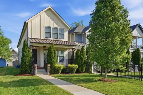 front view of a house with a yard