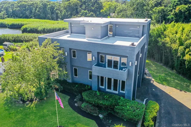 a view of a house with backyard porch and furniture