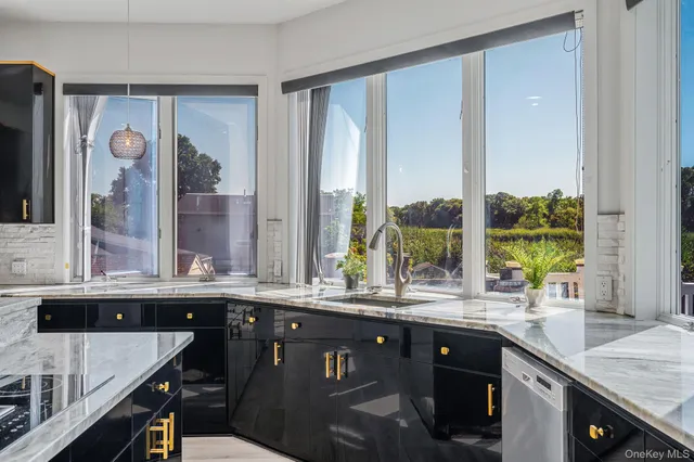 a kitchen with a sink and a large window