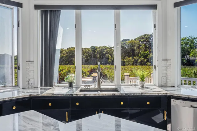 a living room with a large window and table