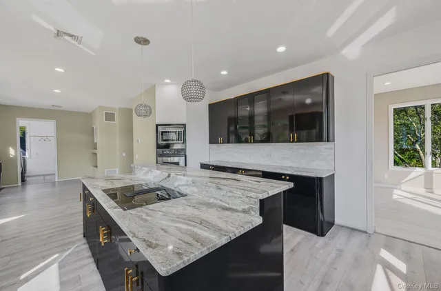 a kitchen with a stove and a sink