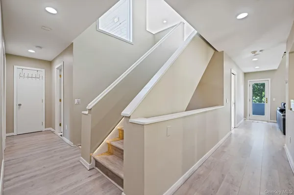 a view of entryway with wooden floor