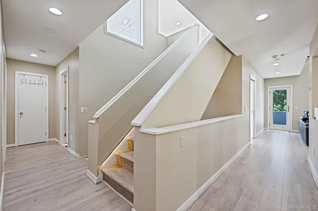 a view of entryway with wooden floor