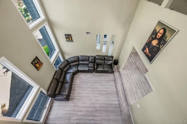 a view of living room with furniture and rug