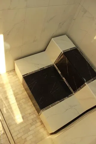 a view of a two chairs on the roof deck