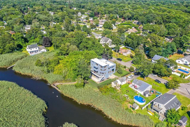 a view of a swimming pool with a yard