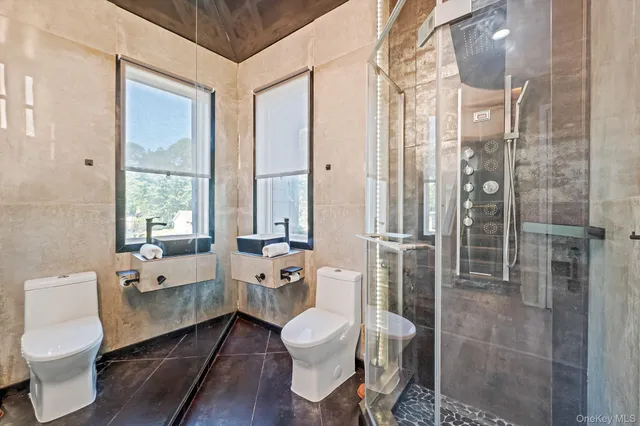 a bathroom with a toilet tub and a shower