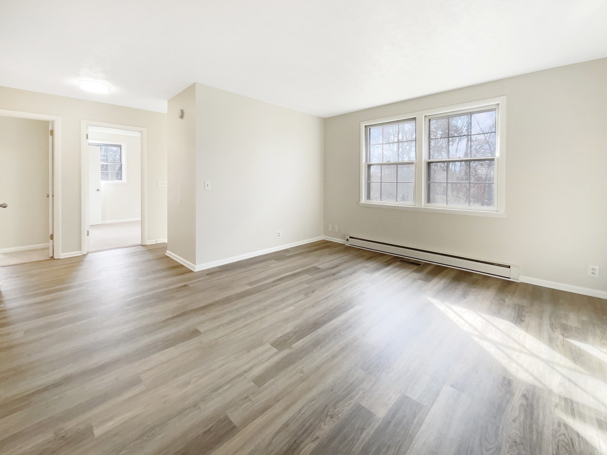 7114 Crow Cut Road Fairview, TN 37062 - Photo 5 of 18 an empty room with wooden floor and windows