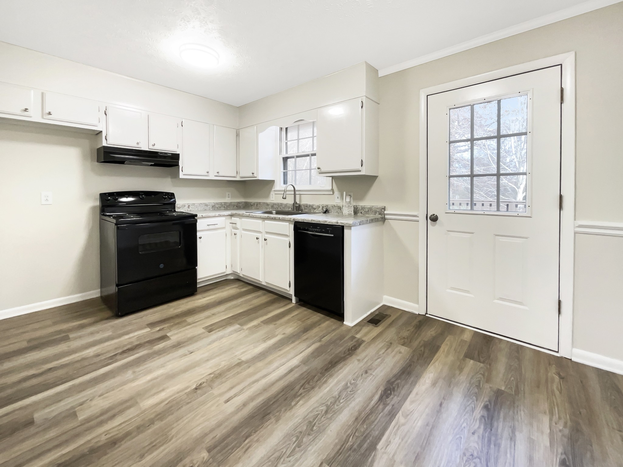 7114 Crow Cut Road Fairview, TN 37062 - Photo 6 of 18 a kitchen with a refrigerator stove top oven and sink