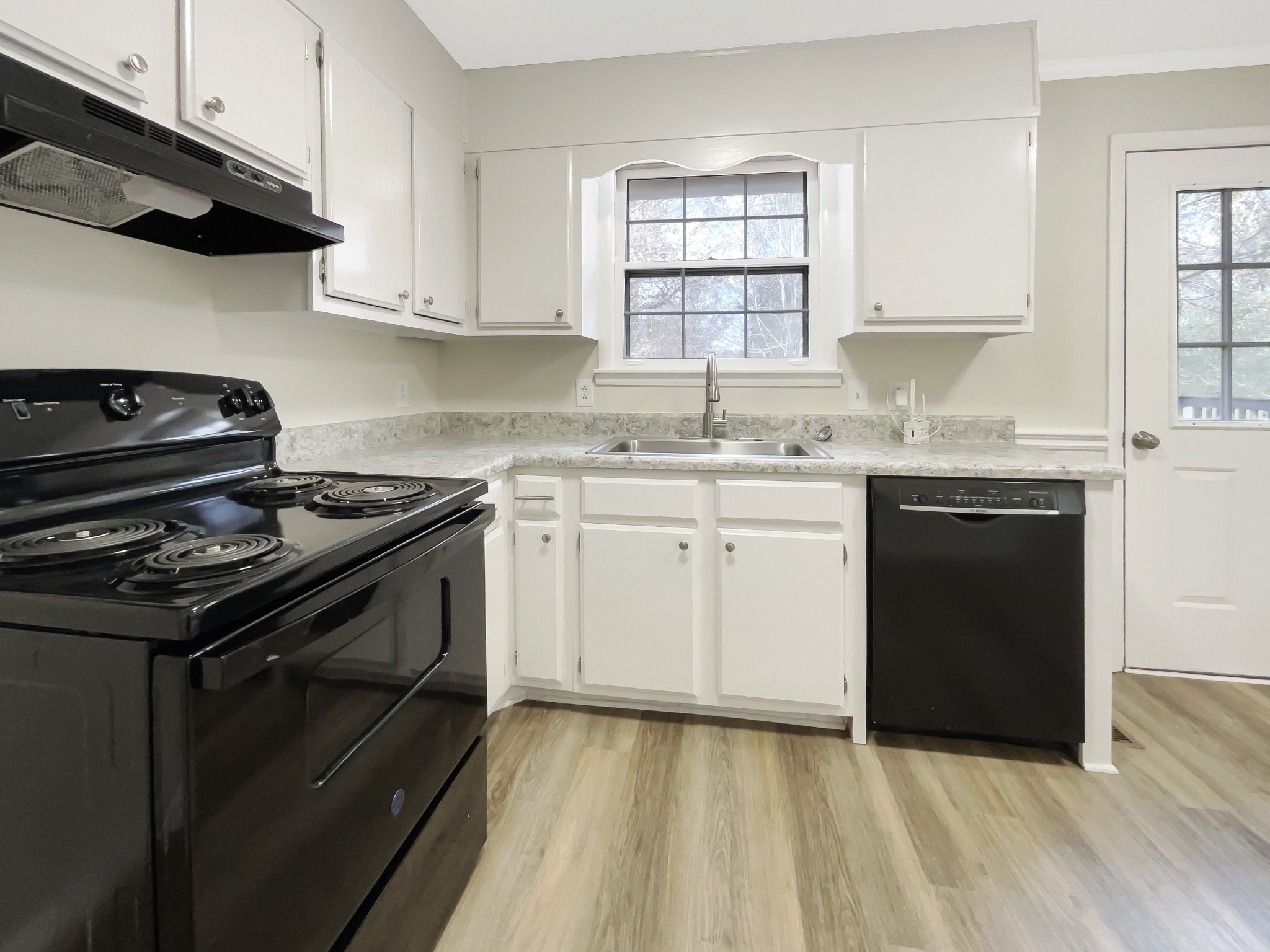 7114 Crow Cut Road Fairview, TN 37062 - Photo 8 of 18 a kitchen with a stove sink and cabinets